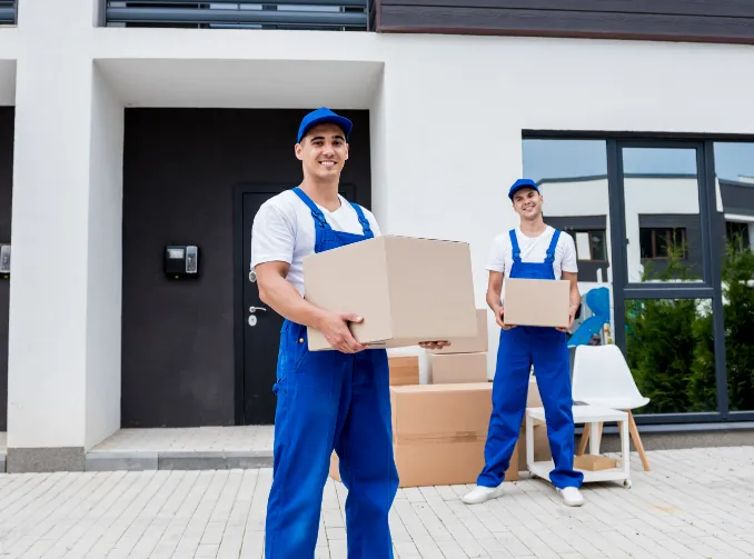 Two movers holding boxes